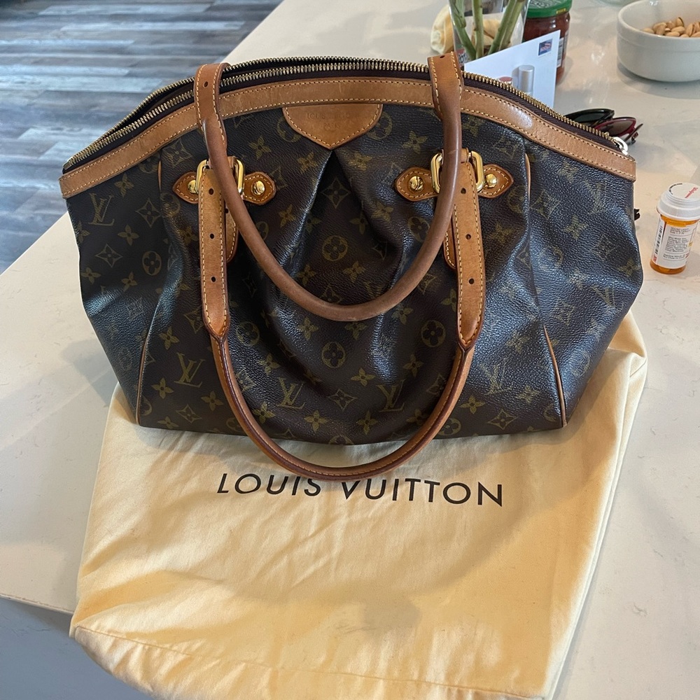 Authentic Louis Vuitton Tivoli GM in excellent condition with dust bag included.
